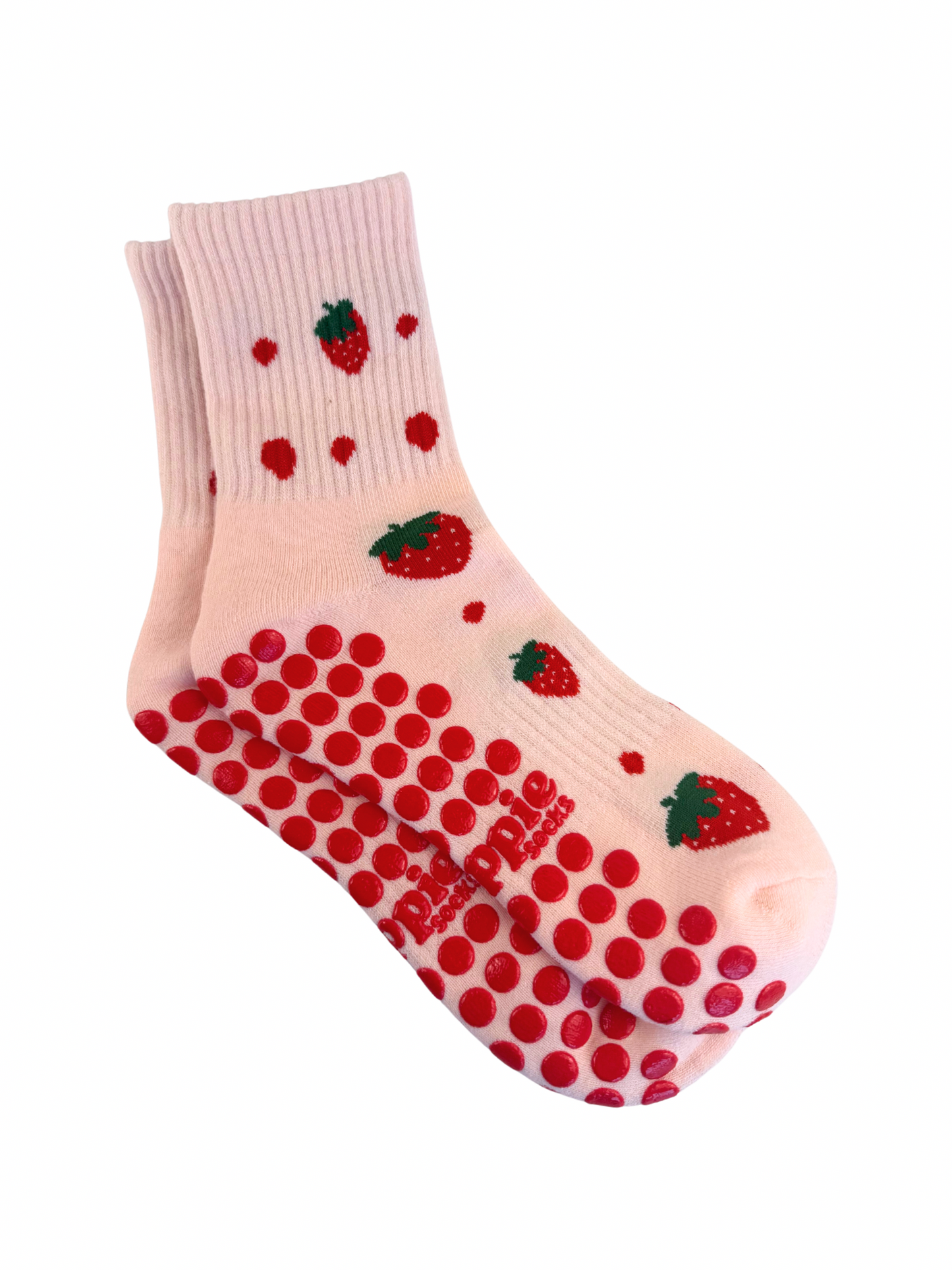 Pink sock with red polka dots and strawberry patterns on a white background