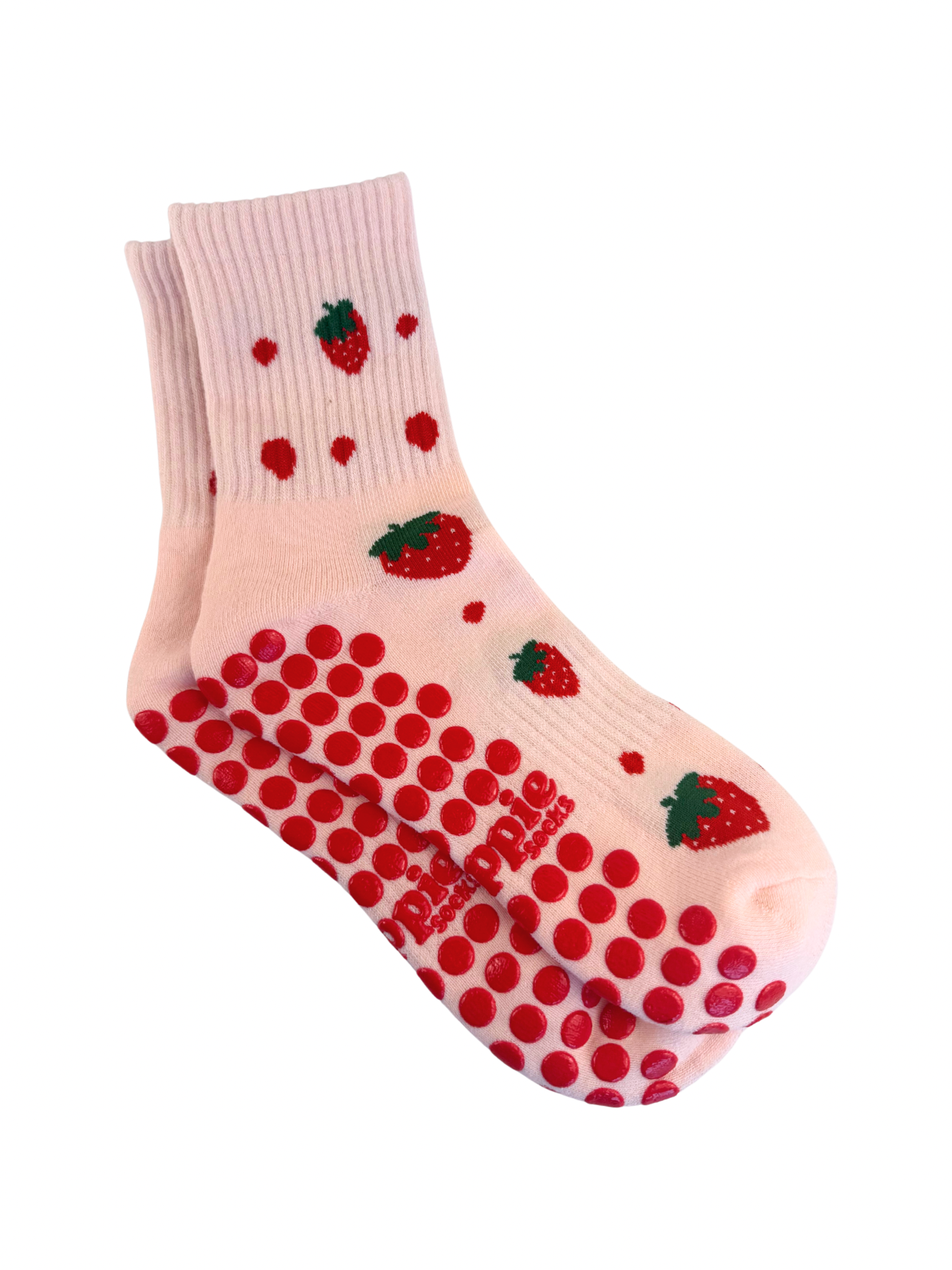 Pink sock with red polka dots and strawberry patterns on a white background